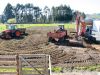 Using tractors and trailers to remove excess